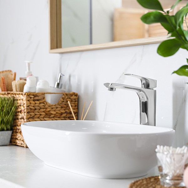 Modern vessel sink with faucet in stylish bathroom | Stonemeyer Granite